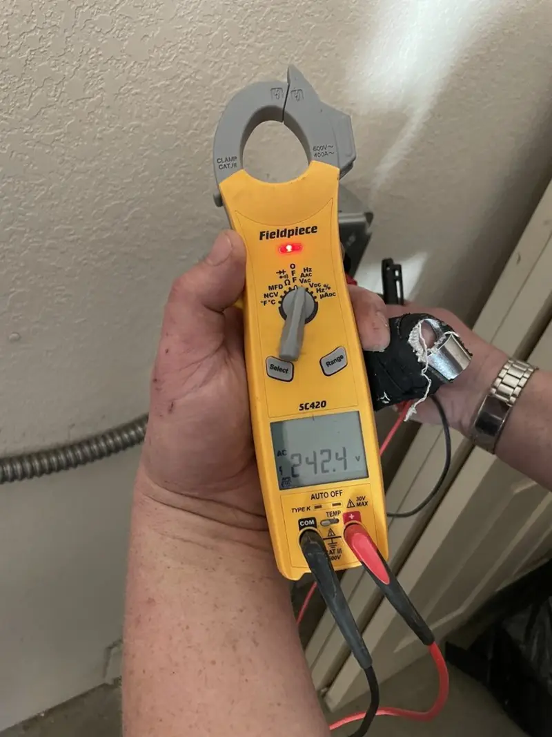 Voltage testing with clamp meter during Outlet Installation in Red Bud